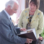 The Mayor presents Sir John with a history of Armagh